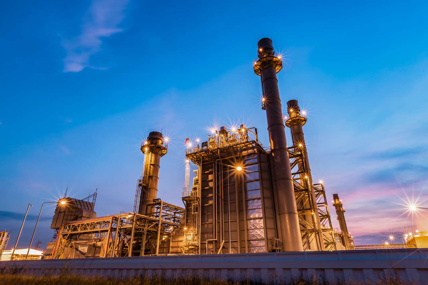 Oil refinery at sunset